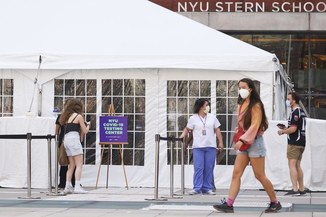 Medical personnel direct students arriving to a COVID-19 testing tent set up at New York University on August 21st, 2020.